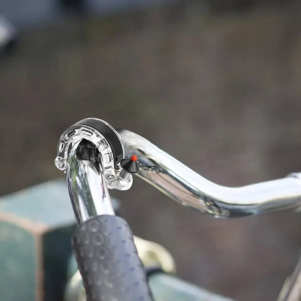 Sonerie de bicicletă în formă de Q