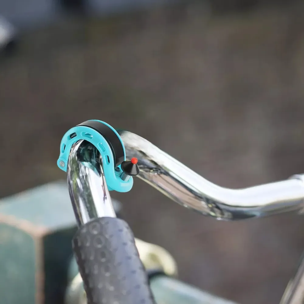 Sonerie de bicicletă în formă de Q